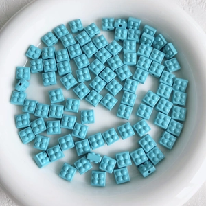 Macro view of blue block beads with studs for DIY jewelry and accessory making