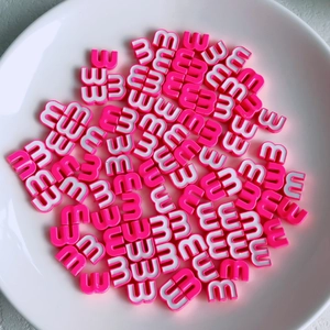 Macro shot of candy colored letter E beads for DIY jewelry and phone chain making