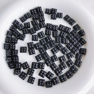 Close-up of black square building block beads for DIY jewelry and accessory making