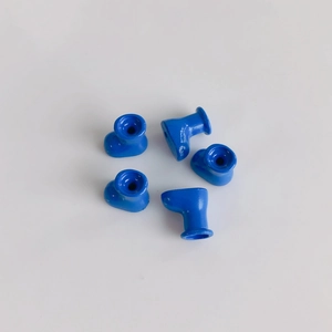 Detail shot of five mini blue macaron-style boot charms for DIY accessories and crafts