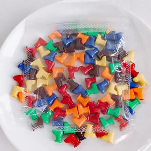 Macro detail of mixed macaron color boot-shaped DIY beads in transparent packaging