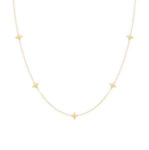 Minimalist gold four-leaf clover necklace with five small star charms on a delicate chain