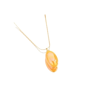 Minimalist gold chain necklace with a translucent pear-shaped amber pendant charm