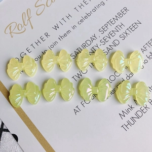 Set of 8 translucent yellow iridescent resin bow charms for DIY jewelry and nail art crafts