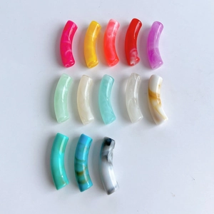 Detailed view of colorful curved tube acrylic beads for DIY bracelet jewelry making