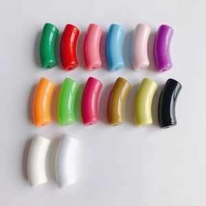 Macro shot of 14 colorful resin curved tube beads for DIY jewelry making with clear holes