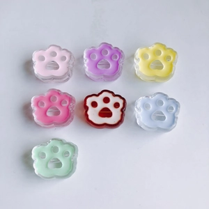 Detailed top view of 7 colorful translucent acrylic bear paw charms for DIY accessories