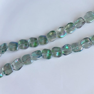 Macro detail of iridescent laser square glass beads for DIY jewelry making with AB coating