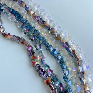 Macro shot of colorful iridescent glass butterfly beads for DIY jewelry making
