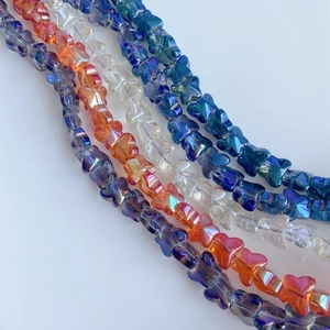 Macro detail of colorful AB coated glass butterfly beads for DIY jewelry making