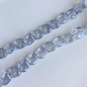 Macro shot of translucent light purple irregular square glass beads for DIY jewelry