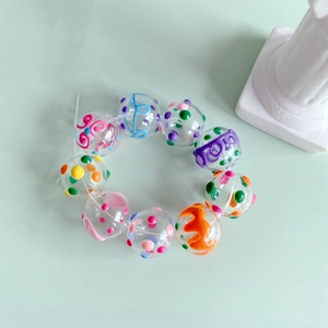Colorful hand-painted transparent glass bead bracelet with vibrant artistic patterns