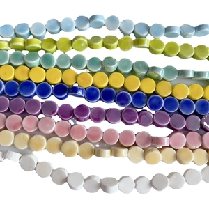 Flat round ceramic beads in assorted pastel colors for DIY jewelry making and crafts