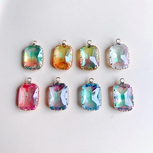 Close-up of geometric rectangle gradient crystal pendants with gold claw settings for DIY