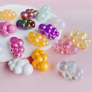 Macro shot of colorful chubby acrylic cloud beads with pearlized and iridescent finish