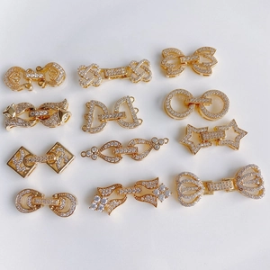 Connettori per gioielli in ottone dorato con zirconi bianchi a forma di fiocco e stella