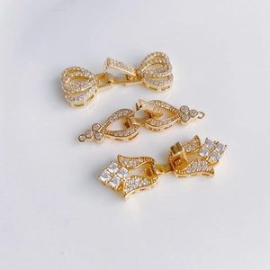 Connettori per gioielli placcati in oro a forma di fiori e fiocchi con pavé di zirconi