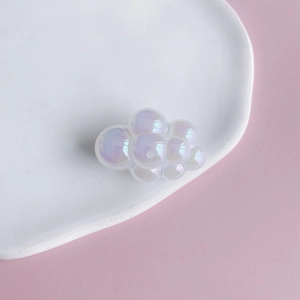 Macro detail of chubby acrylic iridescent cloud charms for DIY keychains and crafts