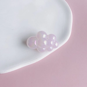Macro shot of a light purple puffy cloud acrylic bead with a pearlescent finish