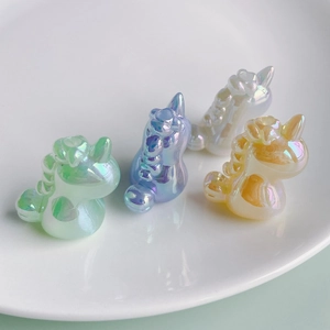Macro detail of aurora finish resin unicorn charms for DIY crafts and keychains