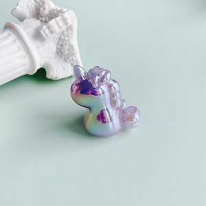 Macro detail of iridescent unicorn charm with vibrant laser gradient and fine resin texture