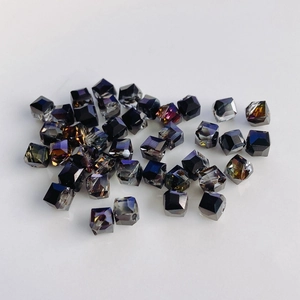 Macro shot of square faceted glass beads with iridescent purple gold AB coating for DIY crafts