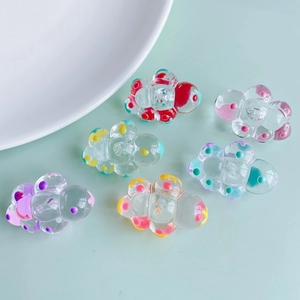 Colorful resin cloud pendants with polka dots on a light green background, DIY jewelry set