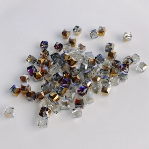 Macro shot of faceted crystal glass square beads with iridescent AB coating for DIY jewelry