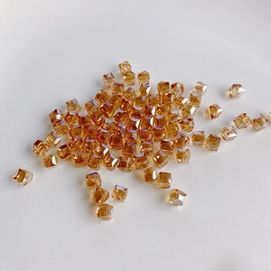 Close-up of amber square faceted glass crystal beads for DIY jewelry making