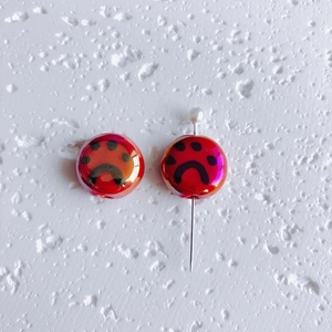 Glossy red round ceramic cat paw beads with abstract face for DIY jewelry making