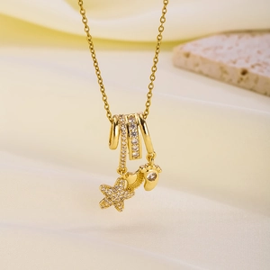 Gold plated necklace featuring micro-set zircon star and footprint pendants on satin stone