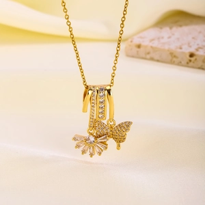 Detail of 18K gold plated necklace featuring a zircon encrusted butterfly pendant