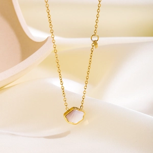 Elegant 18k gold plated starfish necklace with white shell inlay on silk background