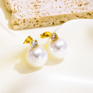 Elegant gold pearl stud earrings with zircon inlay shown on a luxury silk background