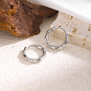 Bamboo-shaped stainless steel hoop earrings with polished silver finish and secure clasp