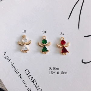 Three gold-plated angel pendants with colorful zircon stones in white, green and red