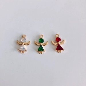 Three angel charms in gold finish featuring clear, emerald, and red cubic zirconia gems