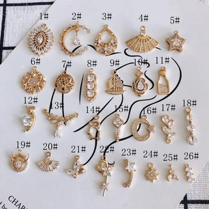 26 gold-plated DIY jewelry pendants featuring moon, stars, and leaves with zircon inlays