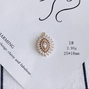 Macro view of gold plated sunflower pendant with marquise zirconia 25x18mm detail