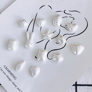 Iridescent white resin charms in rabbit and heart shapes for DIY jewelry and nail art decor