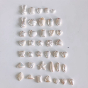 Iridescent aurora resin charms in heart, rabbit, and shell shapes for DIY jewelry making