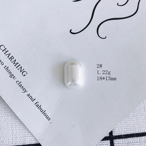 Macro detail of rectangle aurora resin pearl charm measuring 18x13mm for DIY jewelry