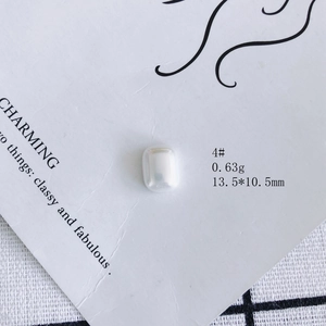 Detail view of aurora pearl resin charm with dimensions 13.5x10.5mm on display card