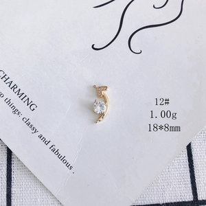 Detail of 18x8mm gold-plated moon charm with zircon inlay for jewelry making