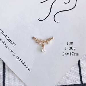 Macro shot of 18k gold plated leaf charm with cubic zirconia for DIY jewelry making