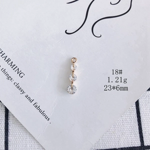 Detailed view of 18K gold plated triple zircon stone pendant 23x6mm for DIY jewelry