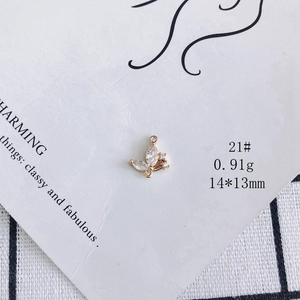 Macro shot of 14x13mm gold-plated butterfly pendant with zircons for jewelry making