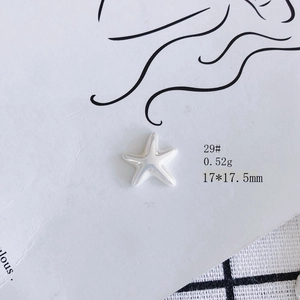 Detailed macro view of a silver starfish pendant with 0.52g weight and 17x17.5mm size