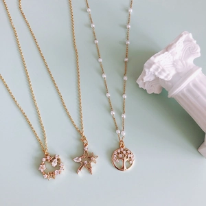 Gold plated charms set featuring wreath star and tree of life pendants for DIY jewelry
