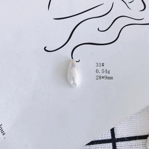 Macro detail of aurora luster drop resin charm with 28mm size for DIY earring making